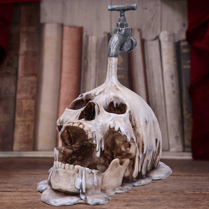 Tapped Skull Figurine